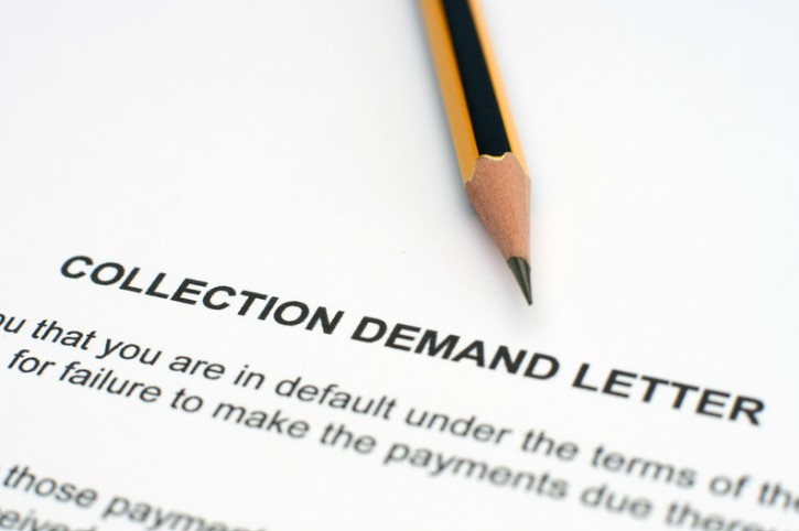 Pencil and paper on a letter of demand
