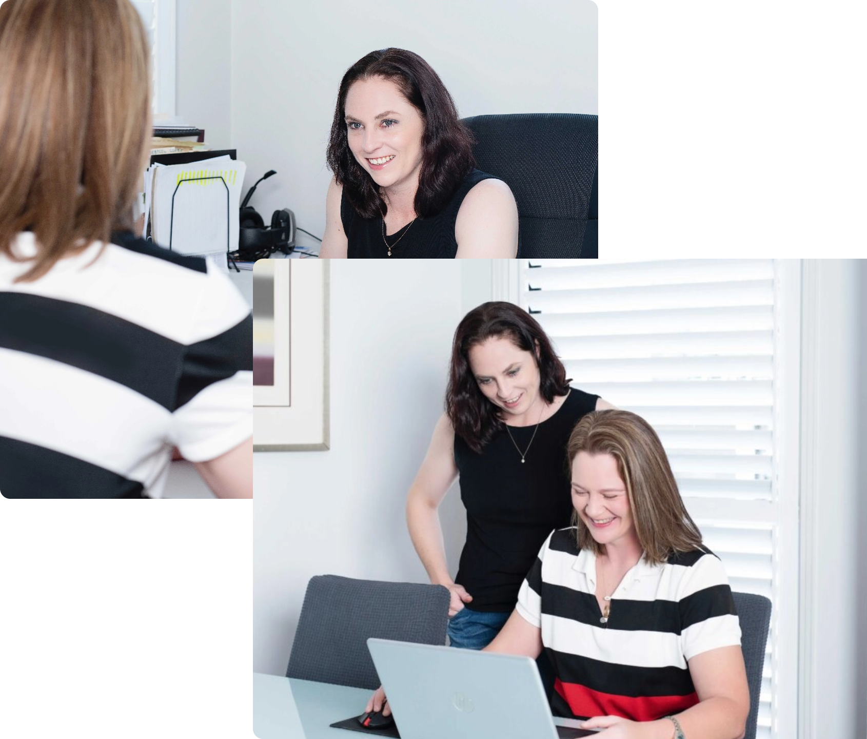 Two women working together in an office setting; one is seated at a desk with a laptop, while the other stands beside her, both appearing engaged in their tasks.